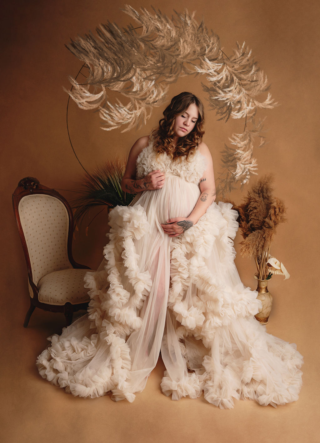Mom to be in neutral tulle maternity gown in an ornate room Access Midwives